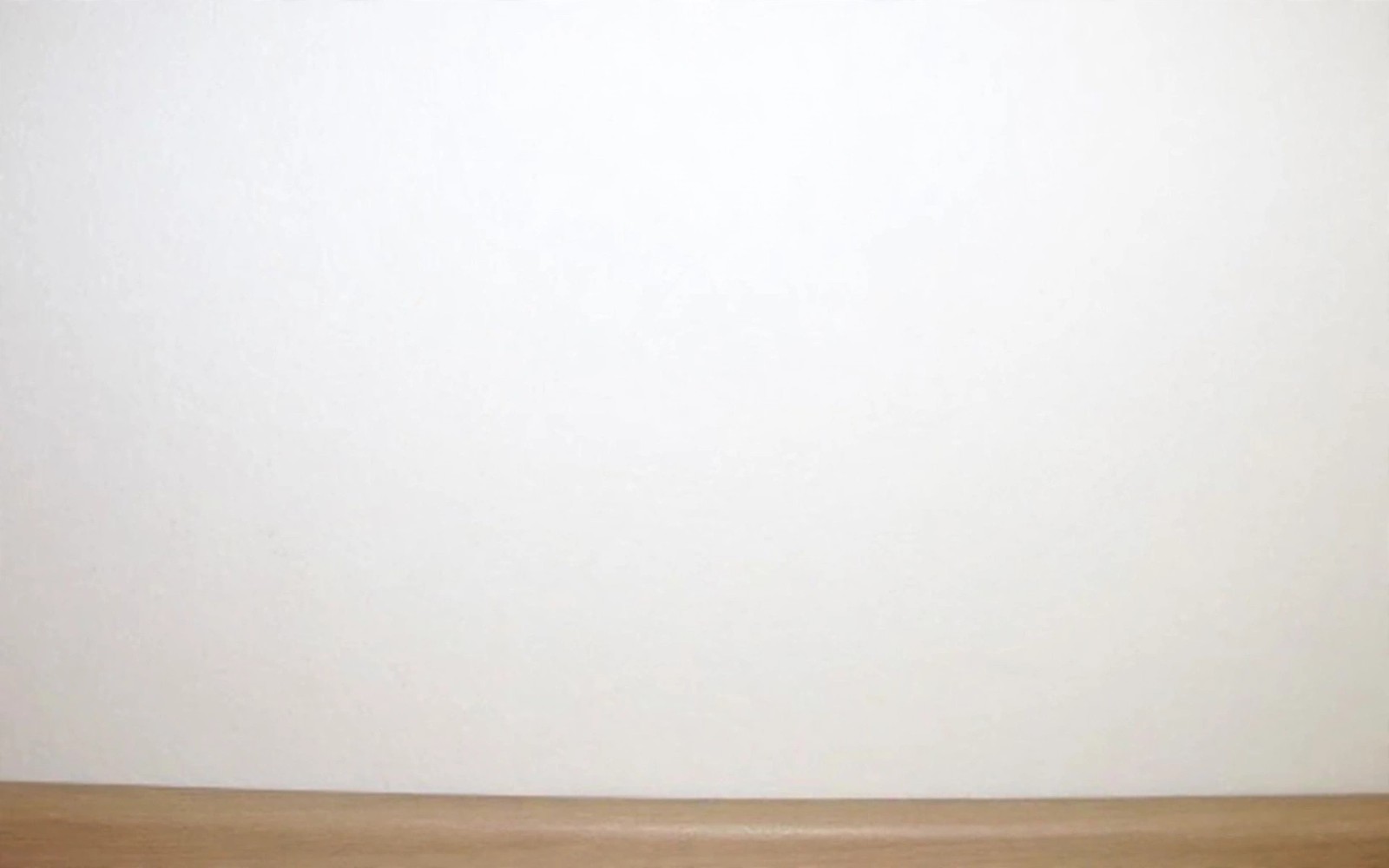 Illustrative example: the same wall cleaned and freshly painted after mold remediation